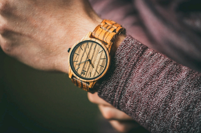 Popular Holiday Gifts for Him 2020, a man wearing a cool, almost wooden-looking, watch